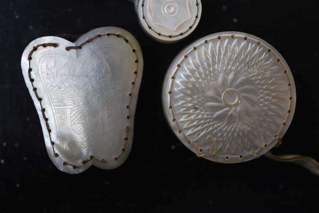 Eight assorted 19th century mother of pearl mounted pin cushions